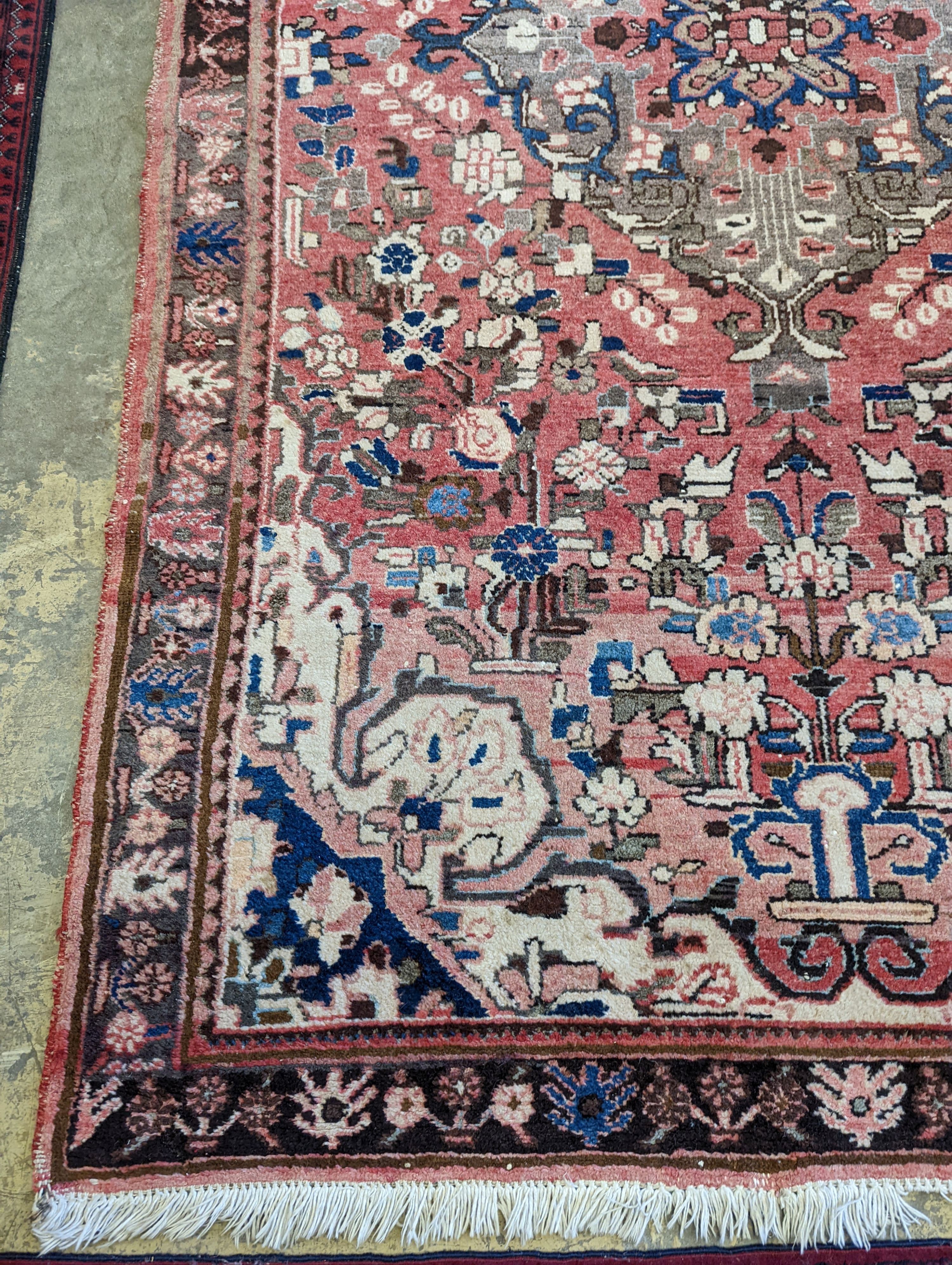 A North West Persian peach ground rug, 240 x 140cm